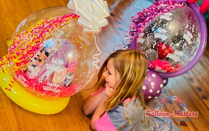 balloons with teddy bear inside