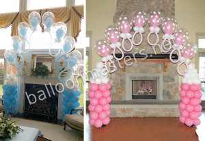 Balloon arch for baby shower made with blue and pink balloons shaped like baby bottles by balloon masters