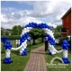 A blue and white balloon arch over a fence gate walkway that is strung to a blue and white column on either side.
