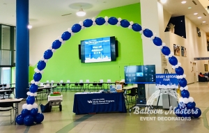 blue and white balloons forming a large arch.
